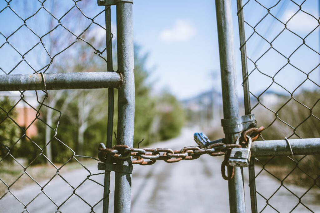 A chain holding a fence together.