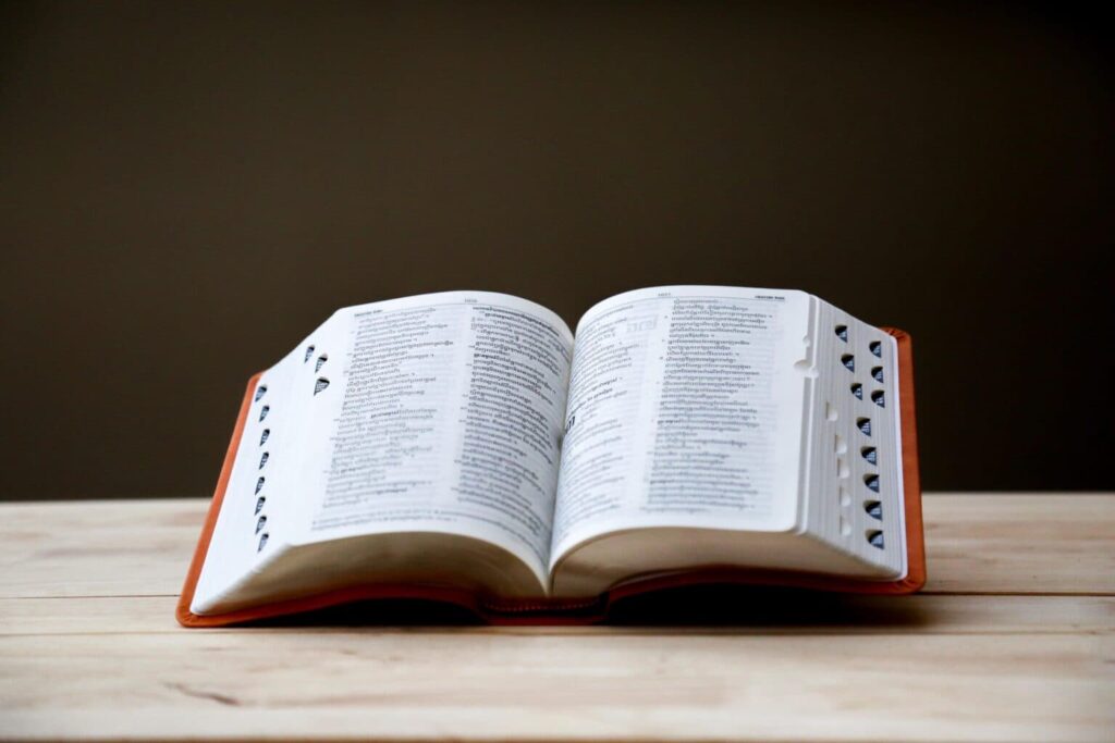 A glossary, in book form, open on a table.