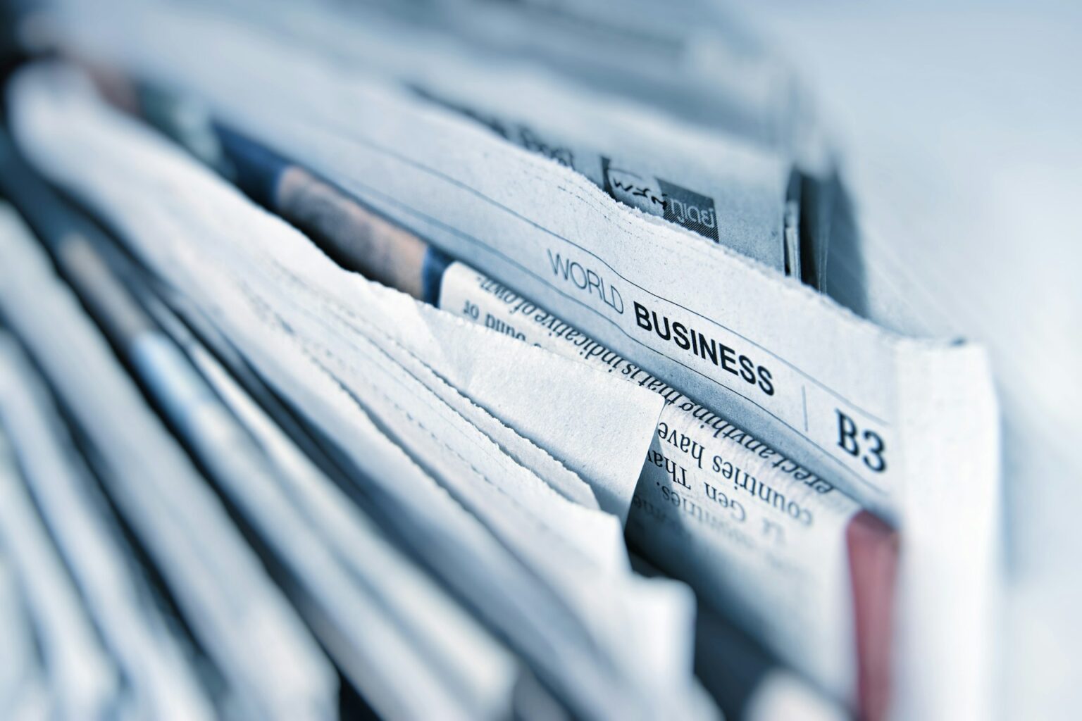 Image of the "business" section of a newspaper.