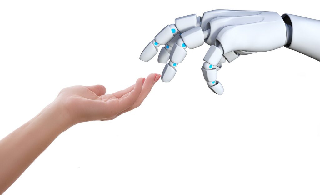 A human hand reaches out to a robot hand